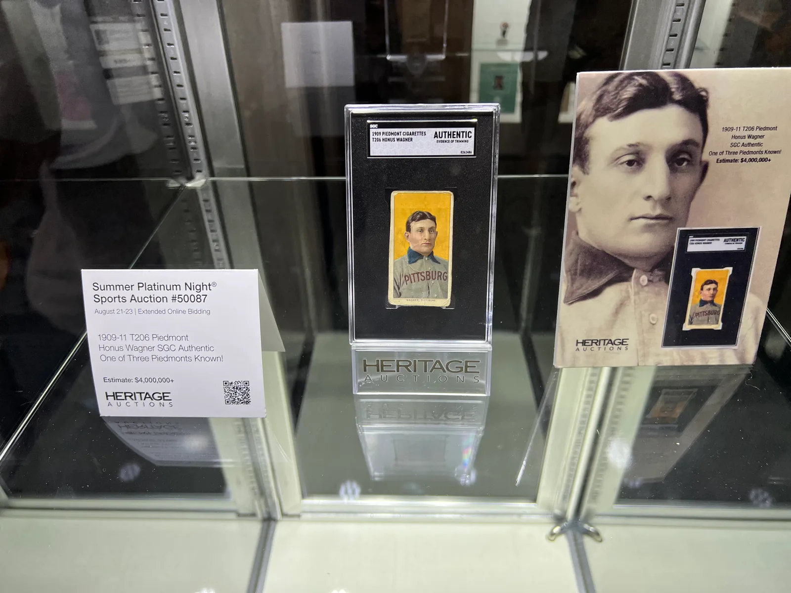 A 1909 T206 Honus Wagner card in a Heritage Auctions display case.