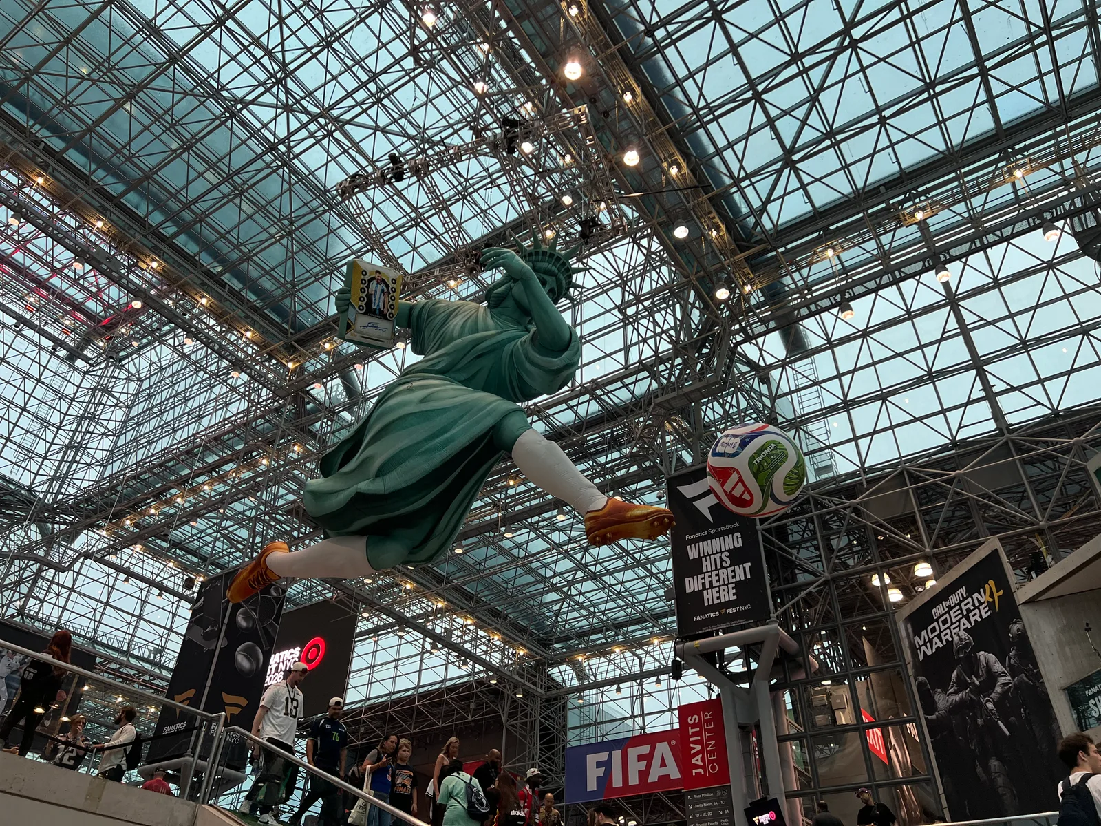 A large Statue of Liberty soccer installation inside the Javits Center.